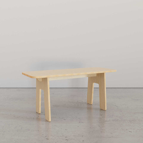 Sleek Modern Bench in light wood, showcasing minimalist design and sturdy legs, ideal for any modern living space.
