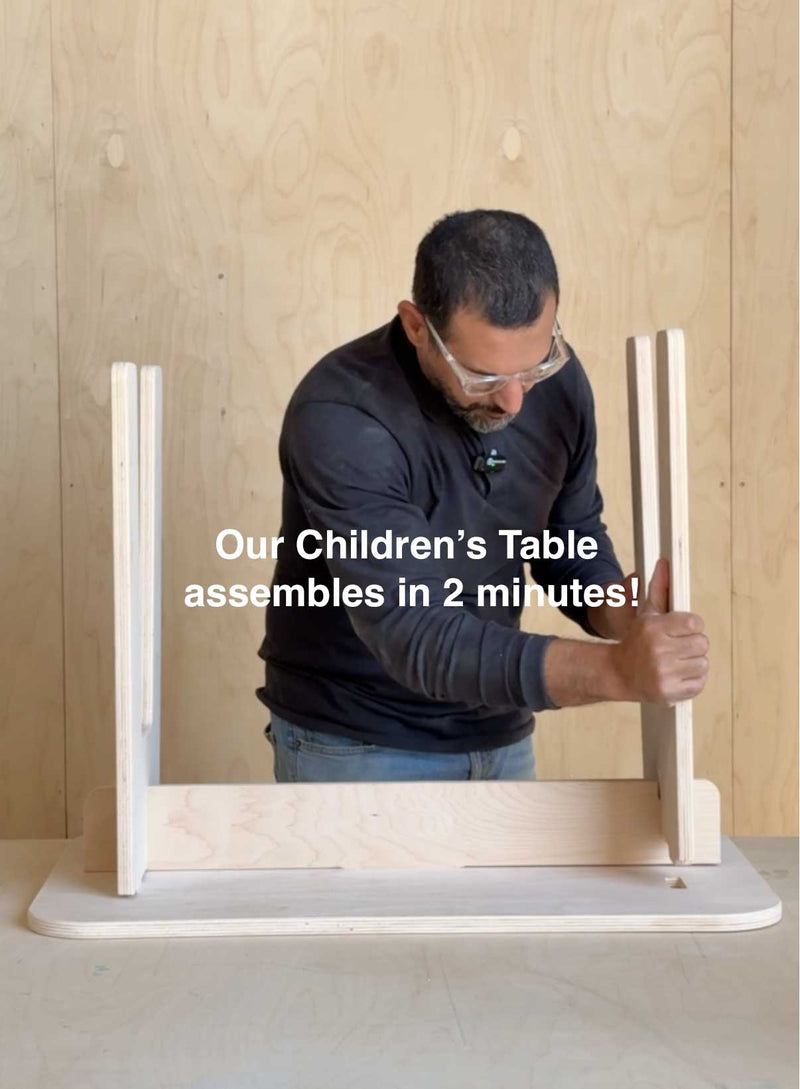 Adult assembling a kids table showcasing quick and easy setup for children's furniture in just 2 minutes.