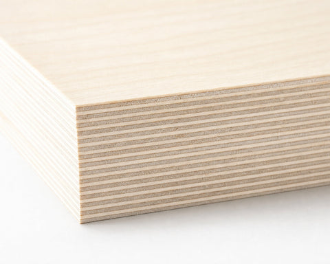 Macro close-up of 13-ply Baltic birch plywood edge showing all layers