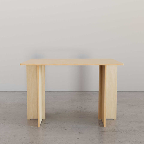 Meet Your New Desk Crush: The UNFNSHED Modern Desk in light wood on a modern concrete floor.