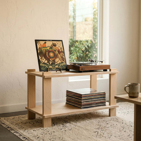 Modular Shelf with turntable on top and vinyl records on the lower tier in a sunlit living room