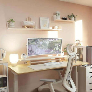 Ergonomic workspace setup with Unfnshed Monitor Stand, white curved monitor, and modern desk in a home office environment.