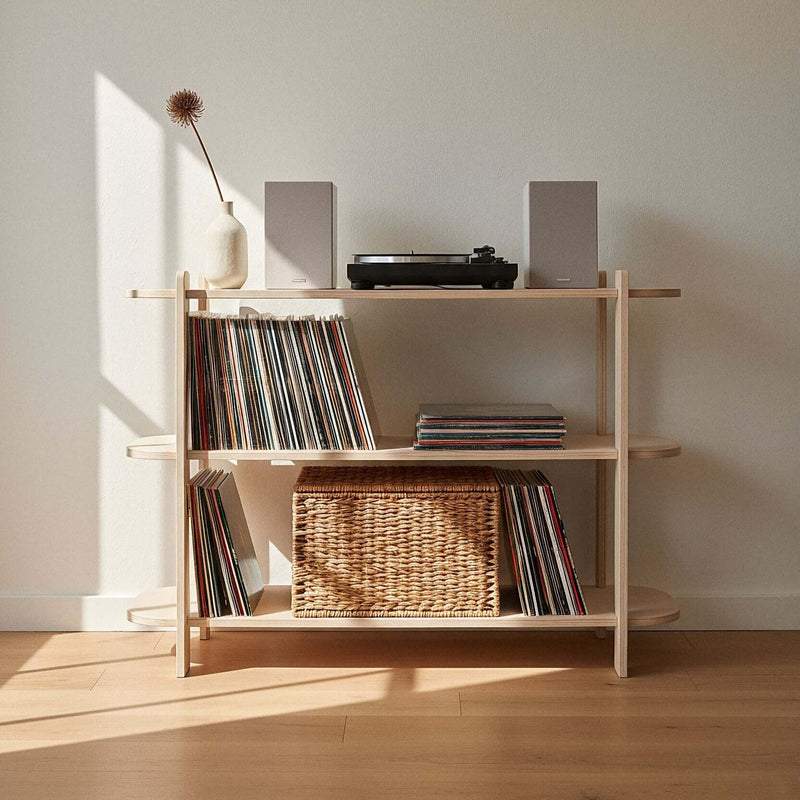 Modern Shelf holding vinyl records, a basket and a turntable