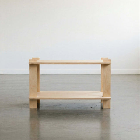 Minimalist wooden table with open shelving, perfect for modern home decor.
