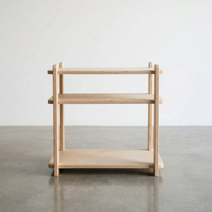 Modern wooden nightstand with open shelving, ideal for stylish bedroom organization.