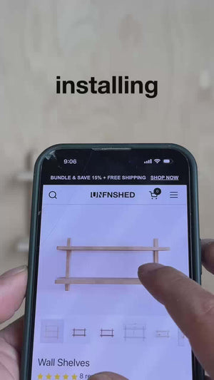 User installing unfinished wall shelves on a smartphone screen, showcasing customization options.