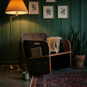 Modern Rocker in a cozy setting with warm lighting, showcasing natural wood and stylish design.